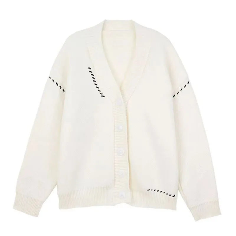 Loose fit black knitted cardigan coat with long sleeves, shown open as a casual layer.