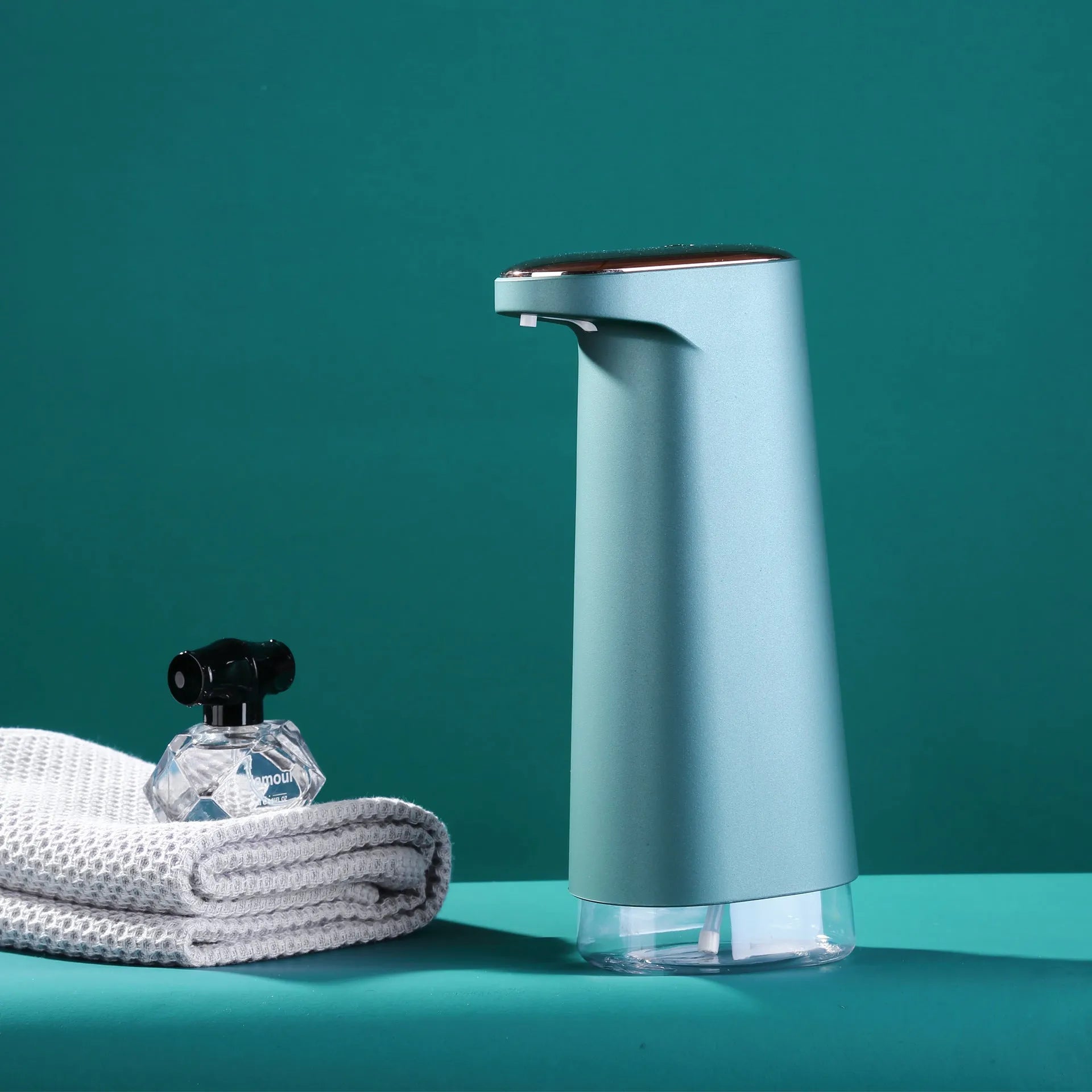 White automatic foam soap dispenser with infrared sensor on a bathroom countertop