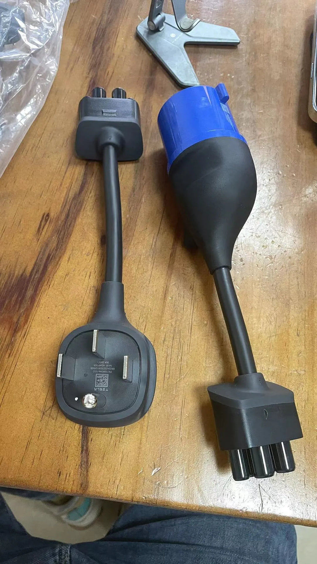 American plug to car charger adapter cable with white sheath on a grey background.