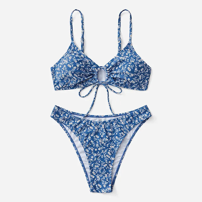 Blue women's swimsuit set with matching top and shorts on a white background.