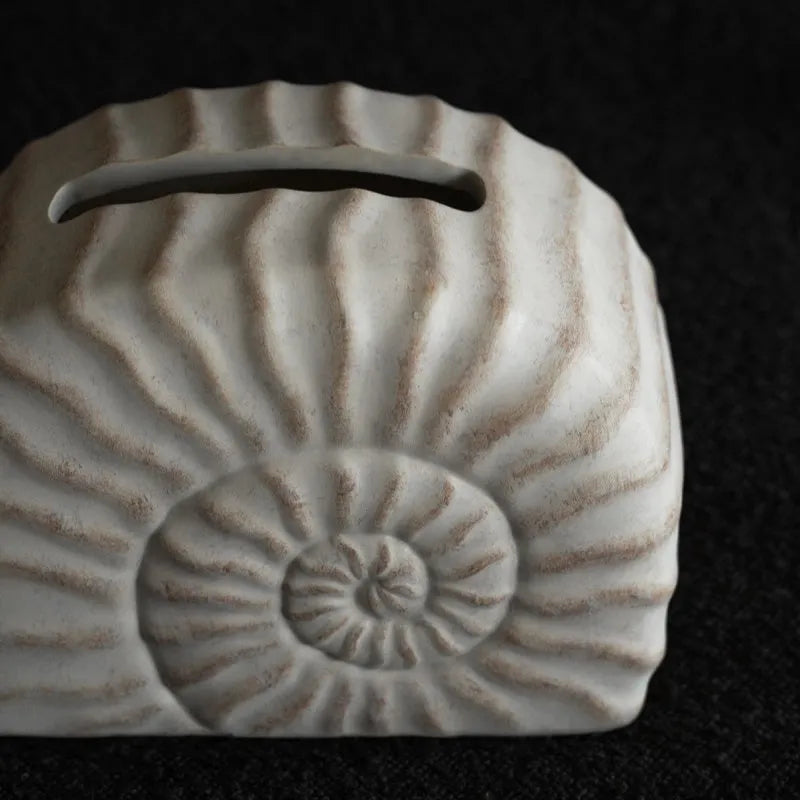 White resin tissue box cover with raised conch shell design