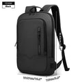 Lightweight solid-colour polyester laptop backpack showing external USB charging port.