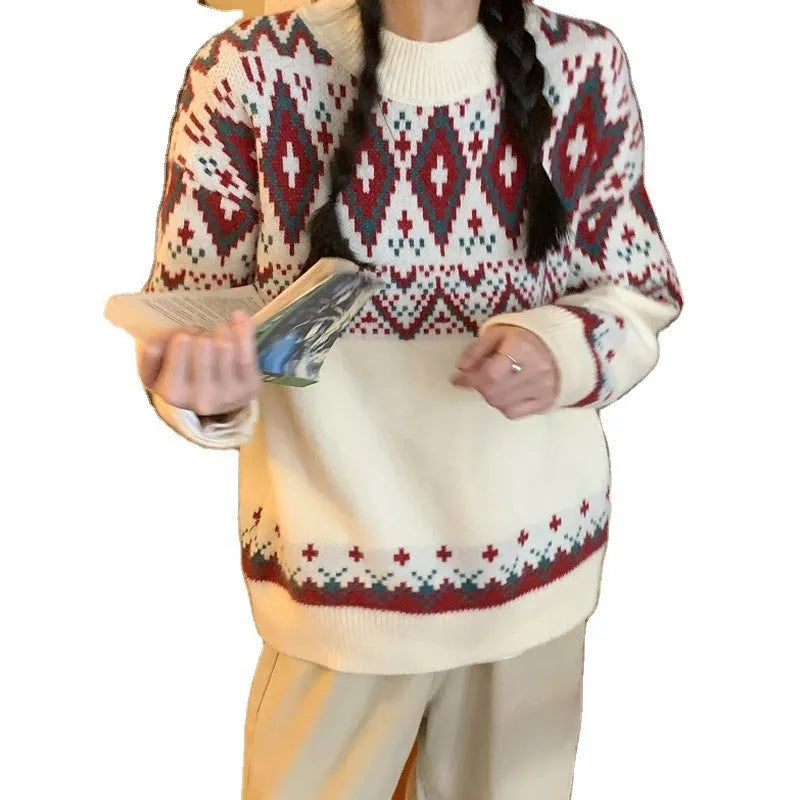 Red and white striped loose-fitting long-sleeved knitted pullover top on a model.