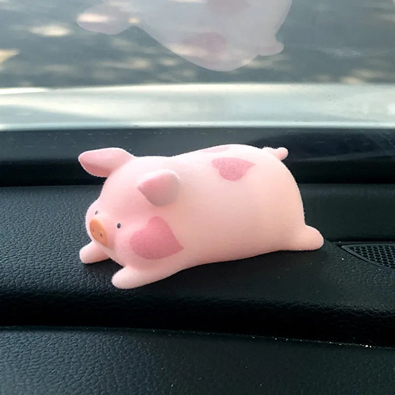 Glossy resin cartoon pig ornament for car dashboard decoration, shown in one of eight available character styles.