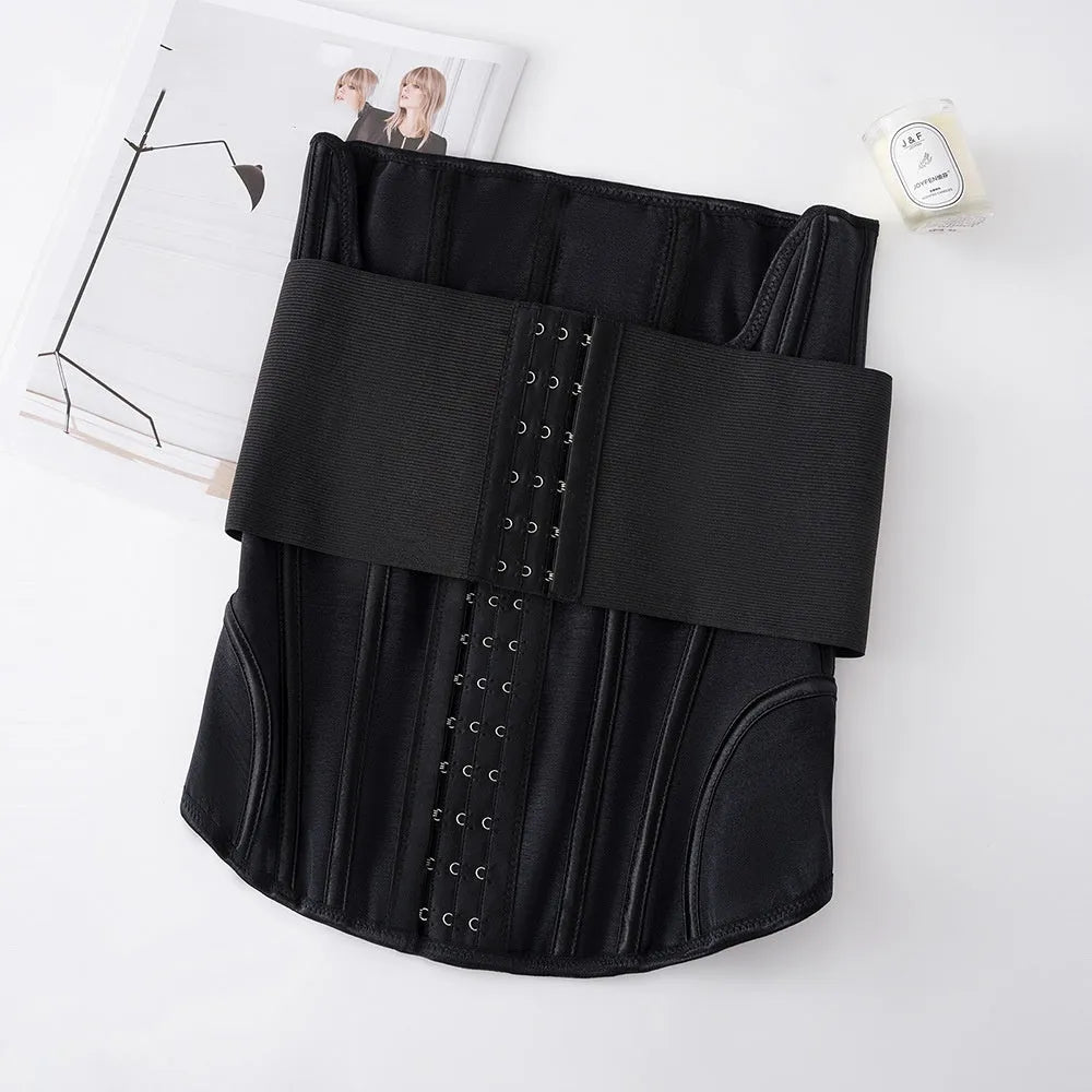Nylon belly band waist trainer in apricot colour with an adjustable tie, laid flat.