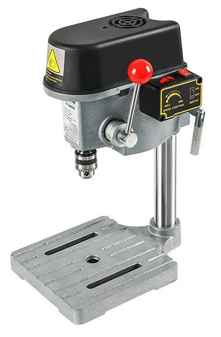 Mini bench drill milling machine on a workbench with optional pliers or drill accessories.