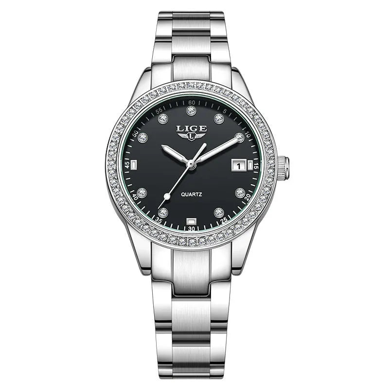 Women's silver fashion watch with diamond bezel, round white dial, luminous hands, and stainless steel bracelet.