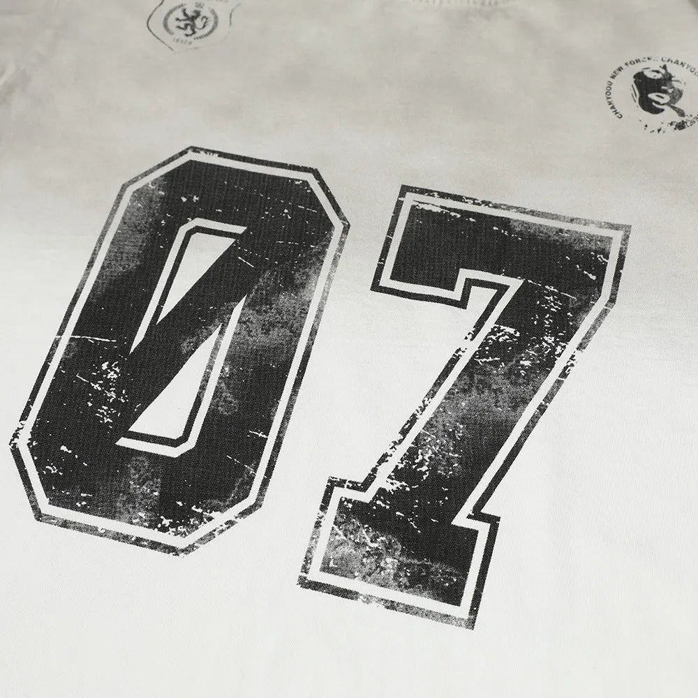 Men's black and white printed short-sleeved cotton t-shirt on a hanger, showing sizes S, M, L, XL.
