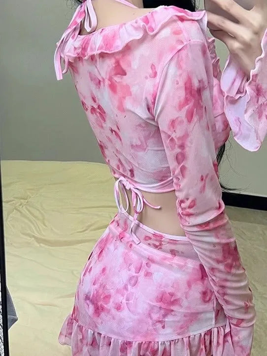 Women's cherry blossom pink floral print bikini swimsuit set on a mannequin.