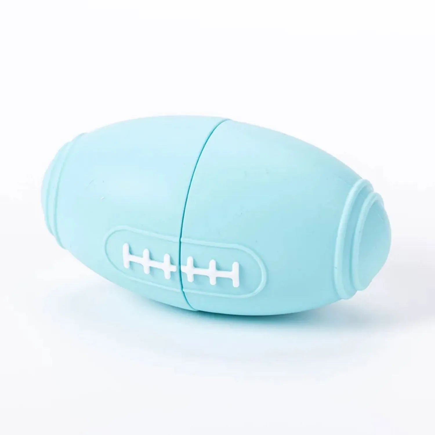 Blue silicone rugby ball dog toy with treat-dispensing centre for chewing and fetching