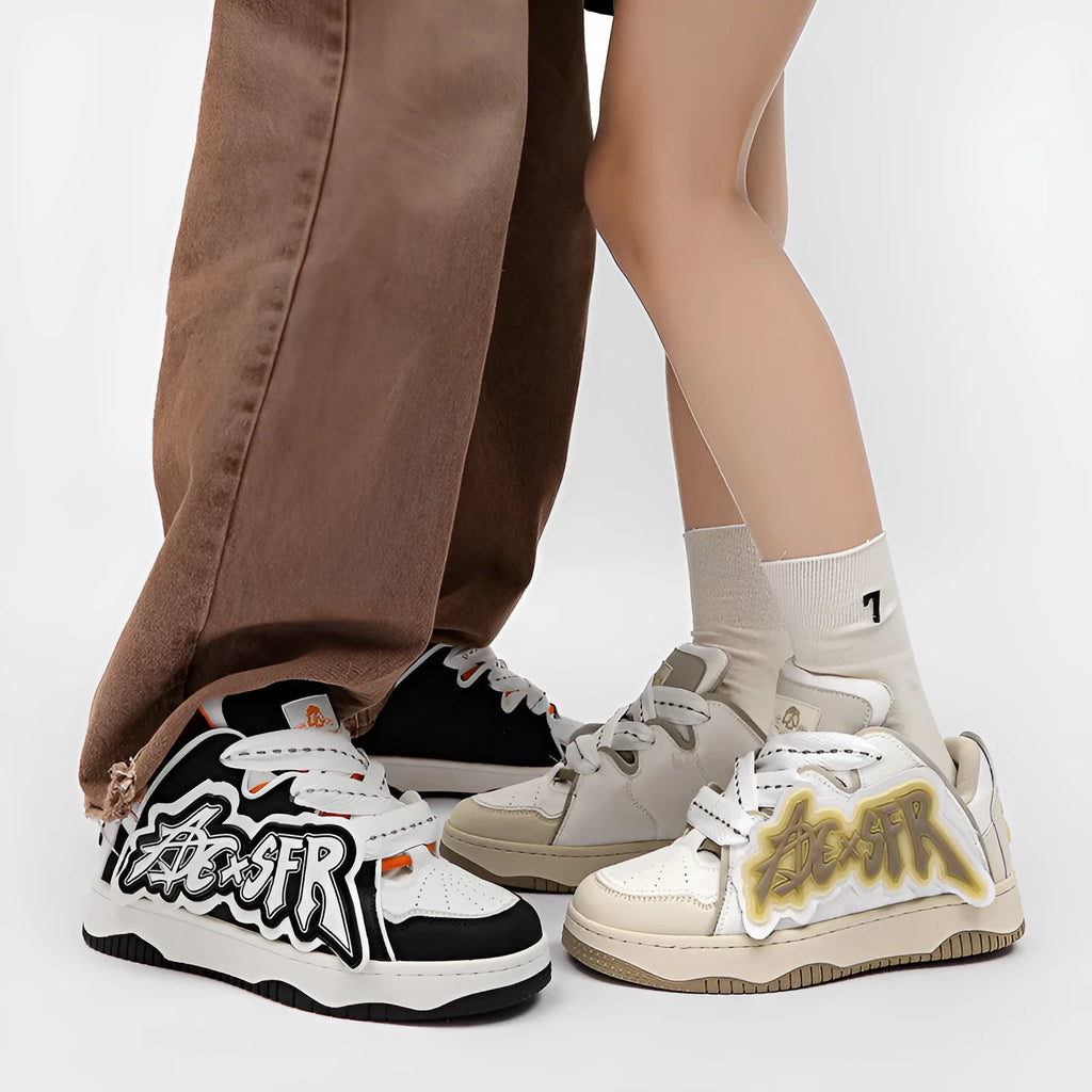 Low-top canvas skate shoes with front lacing, mesh lining, PU insole and rubber sole in white and black, black and red or sky