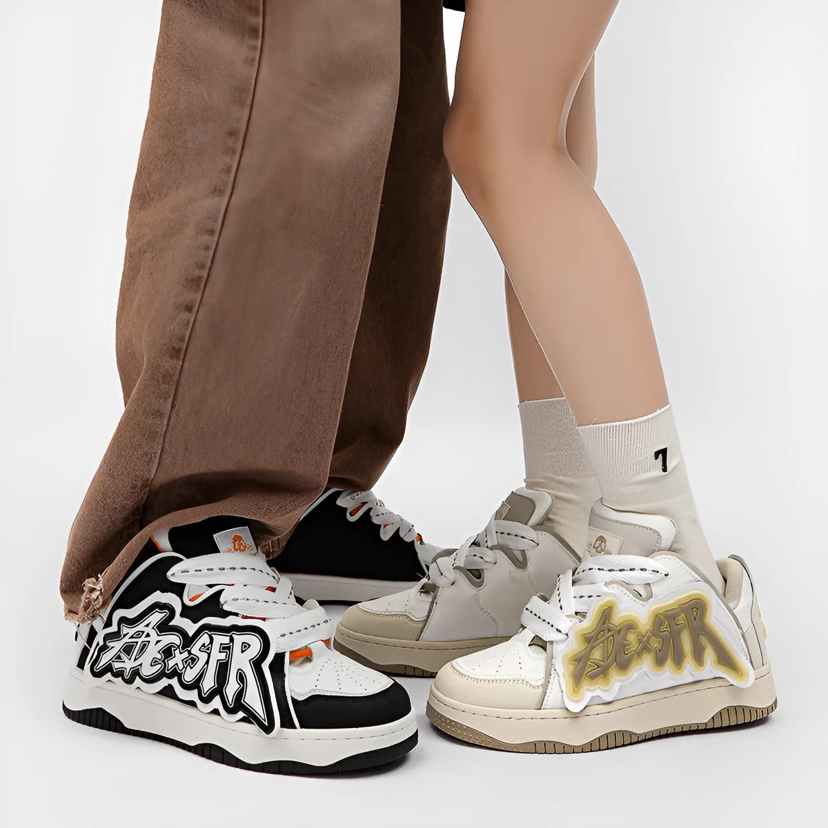 Low-top canvas skate shoes with front lacing, mesh lining, PU insole and rubber sole in white and black, black and red or sky