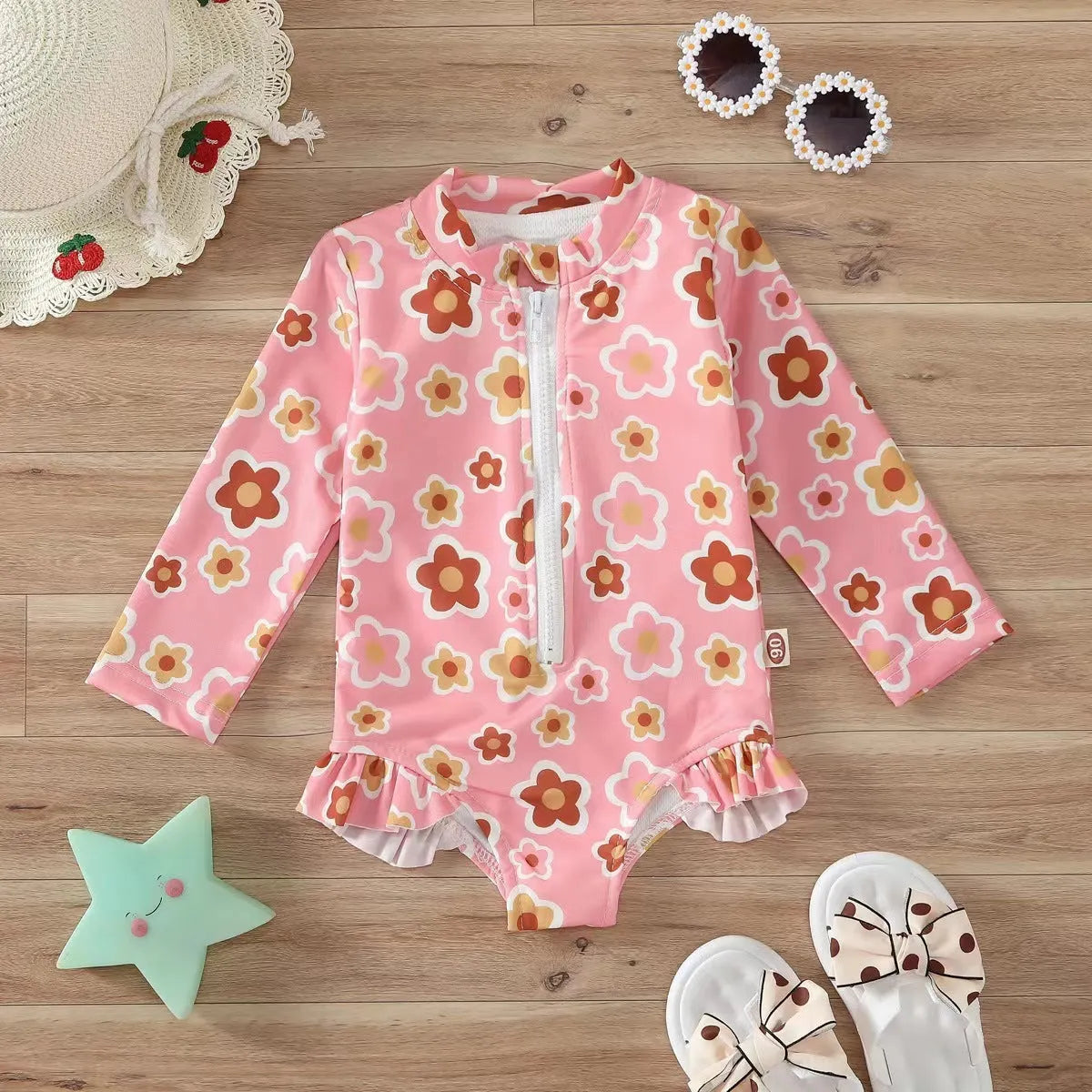 Girls' one-piece floral zipper romper swimsuit in pink, full front view, polyester spandex fabric