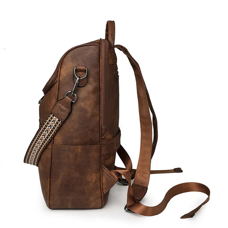 Retro college student backpack with curved shoulder straps in six colour options including black, blue and brown variations
