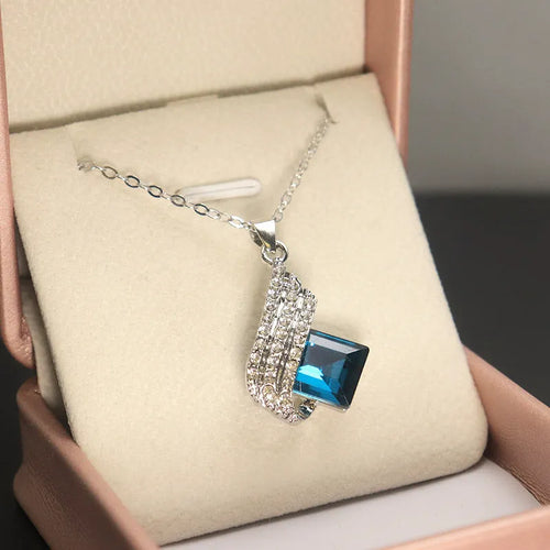 Alloy necklace with glass pendant and matching ear studs featuring cross chain design in jewellery set