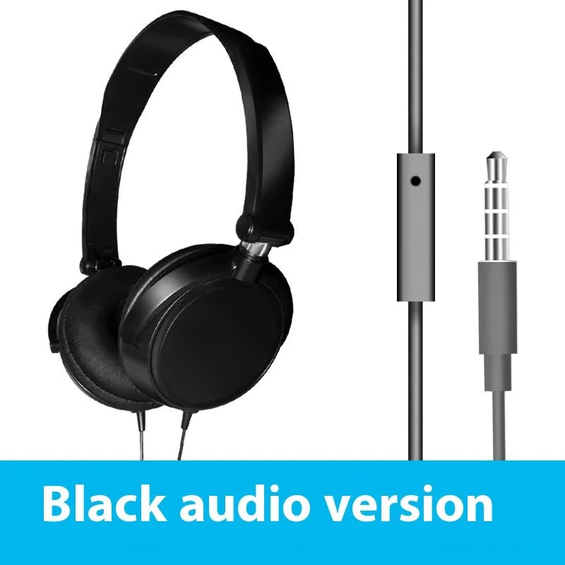 Red folding over-ear wired headphones with adjustable headband and 3.5mm plug on a table