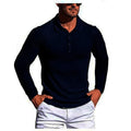 Man wearing a loose-fit black and white striped short-sleeve knit top.