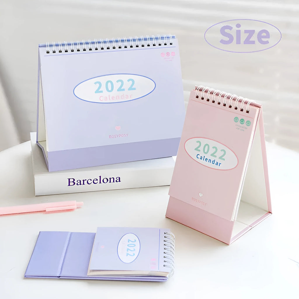 Cream coil bound desk calendar with paper pages, 100mm x 100mm for small desk use