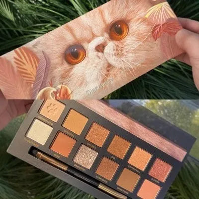 Animal-themed twelve-colour eyeshadow palette showing golden tiger, ink cat, red fox, and koi shades