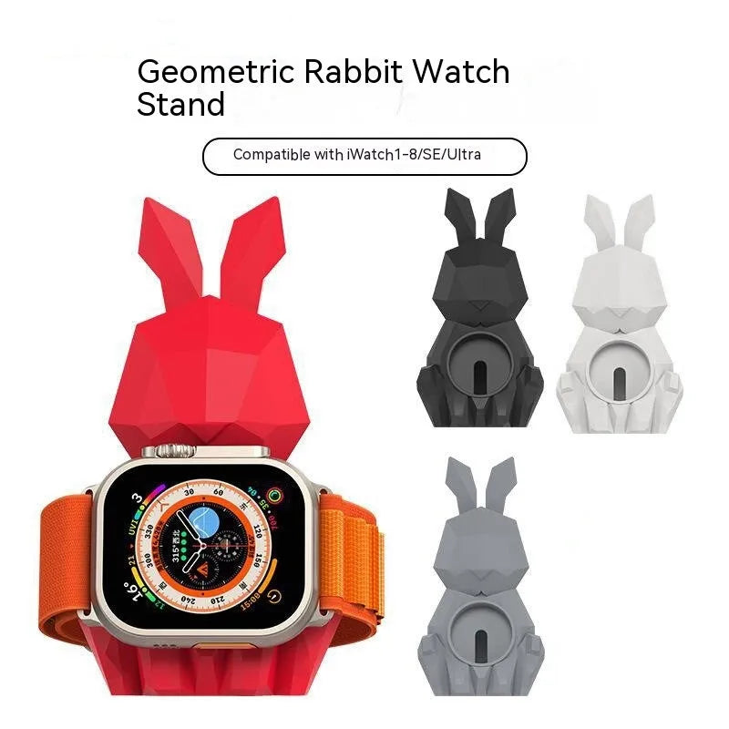 Rabbit-shaped silicone desk charger bracket in white with wrist strap holding a charging cable