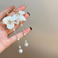 Women's shell pearl and tassel drop earrings with 8.8cm length on acrylic backing