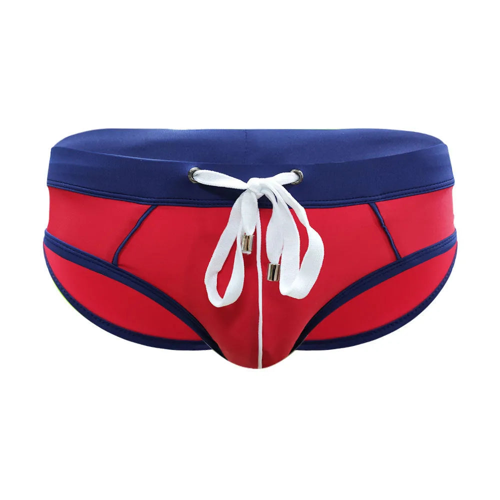 Nylon men's swim briefs in orange colour with elastic waistband, front view