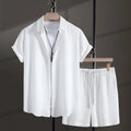 Men's loose fit cotton blend beach shorts suit in black, showing short sleeve shirt and matching shorts.