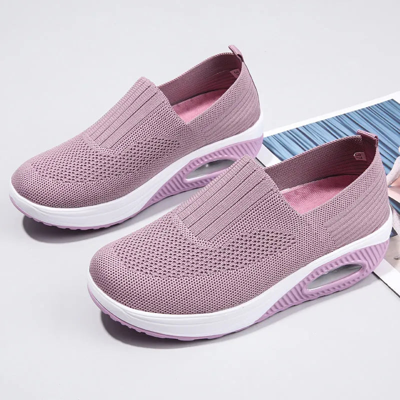 Women's black mesh running shoes with round toe and mid heel on a white background