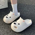 Women's black EVA slipper sandals with puppy toe cap design showing injection-moulded sole