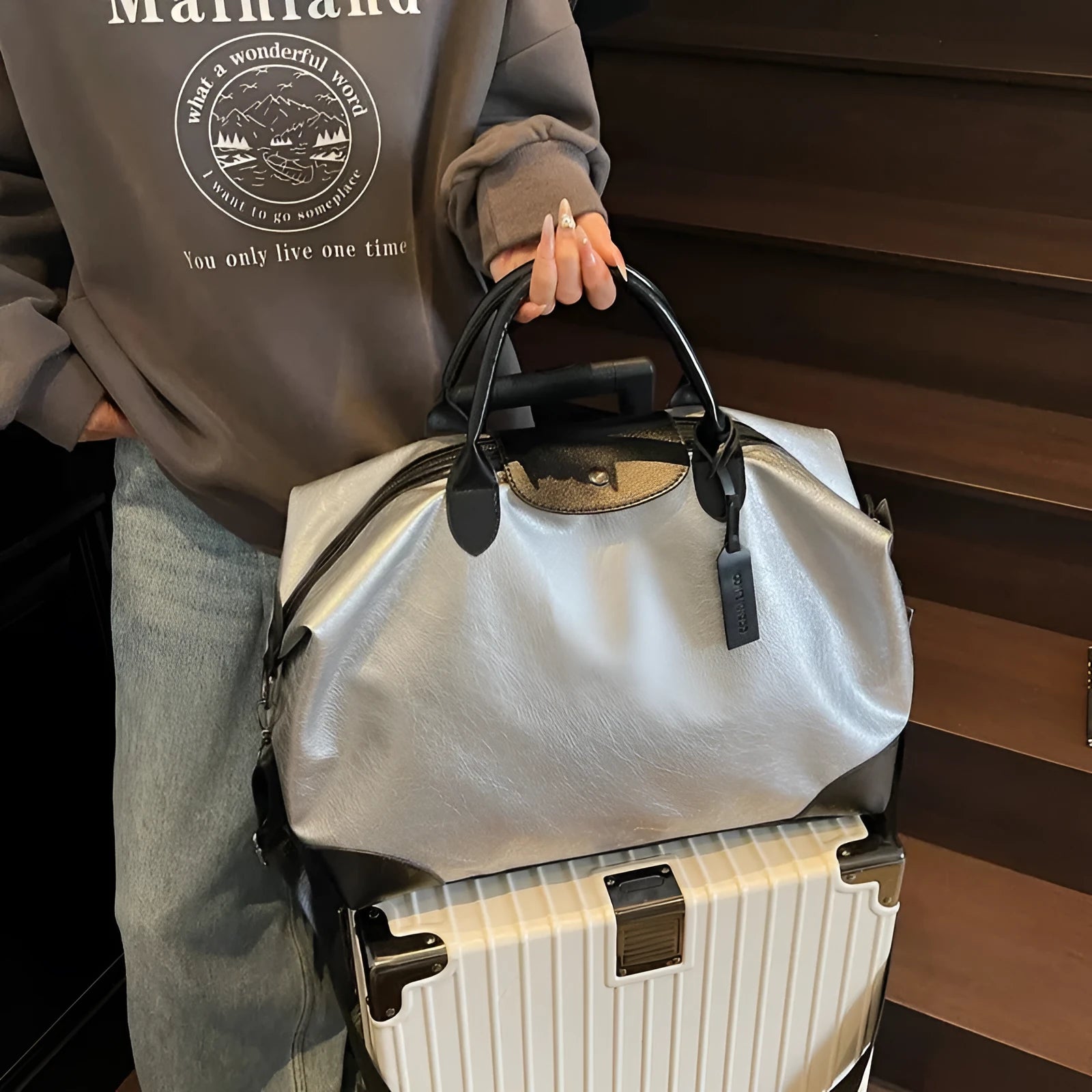 Black women's hand-carry travel bag with 36-55 litre capacity for short trips
