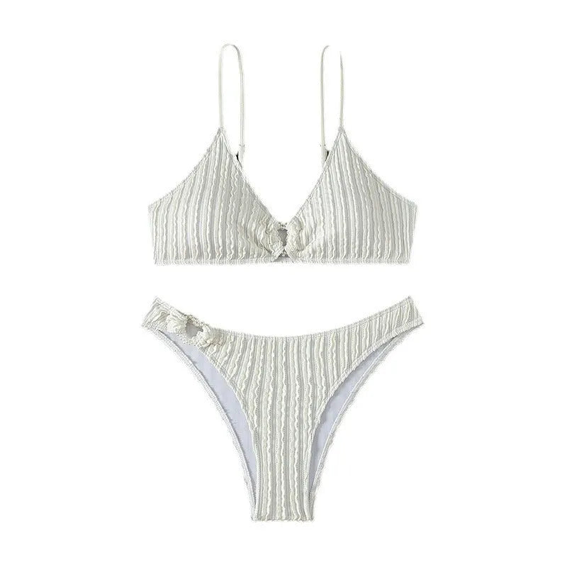 White women's V-neck swimsuit with split design for beach swimming.