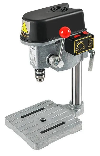 Mini bench drill milling machine on a workbench with optional pliers or drill accessories.