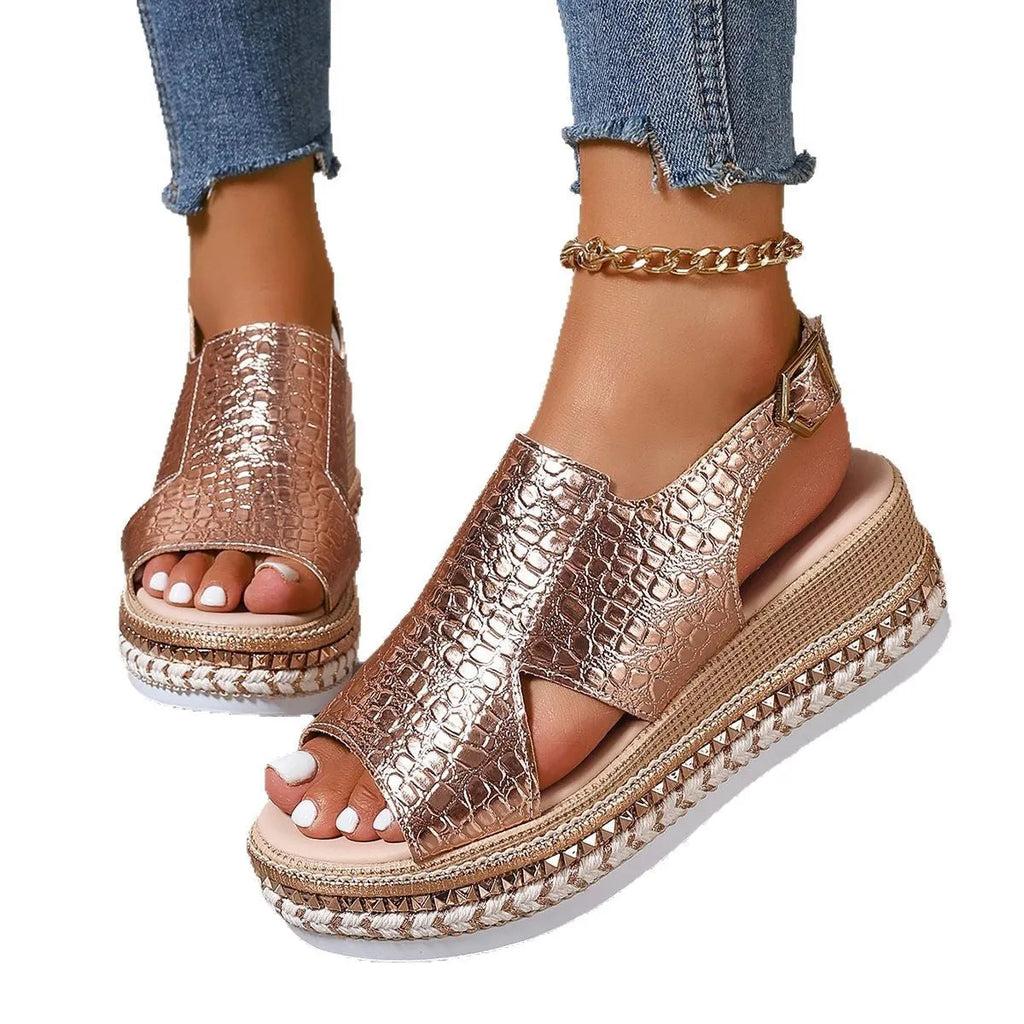Gold women's Roman sandals with hollow-out design and an ankle buckle fastening.