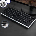 Heijue AK33 82-key mechanical keyboard black shaft white light version on desk with metal panel