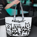 A waterproof woven handbag with a snakeskin pattern colour print, made from PP material.