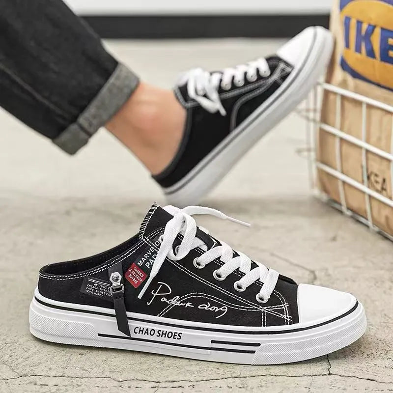 Men's canvas slip-on sports casual shoes in black with round toe design and letter pattern detail