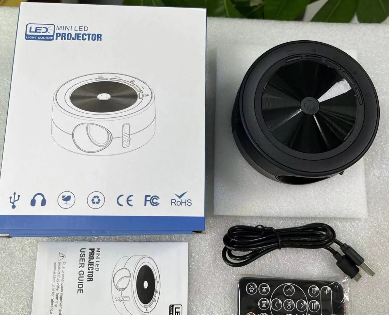 YT200 portable LED projector in black white yellow white blue white colour options with remote control