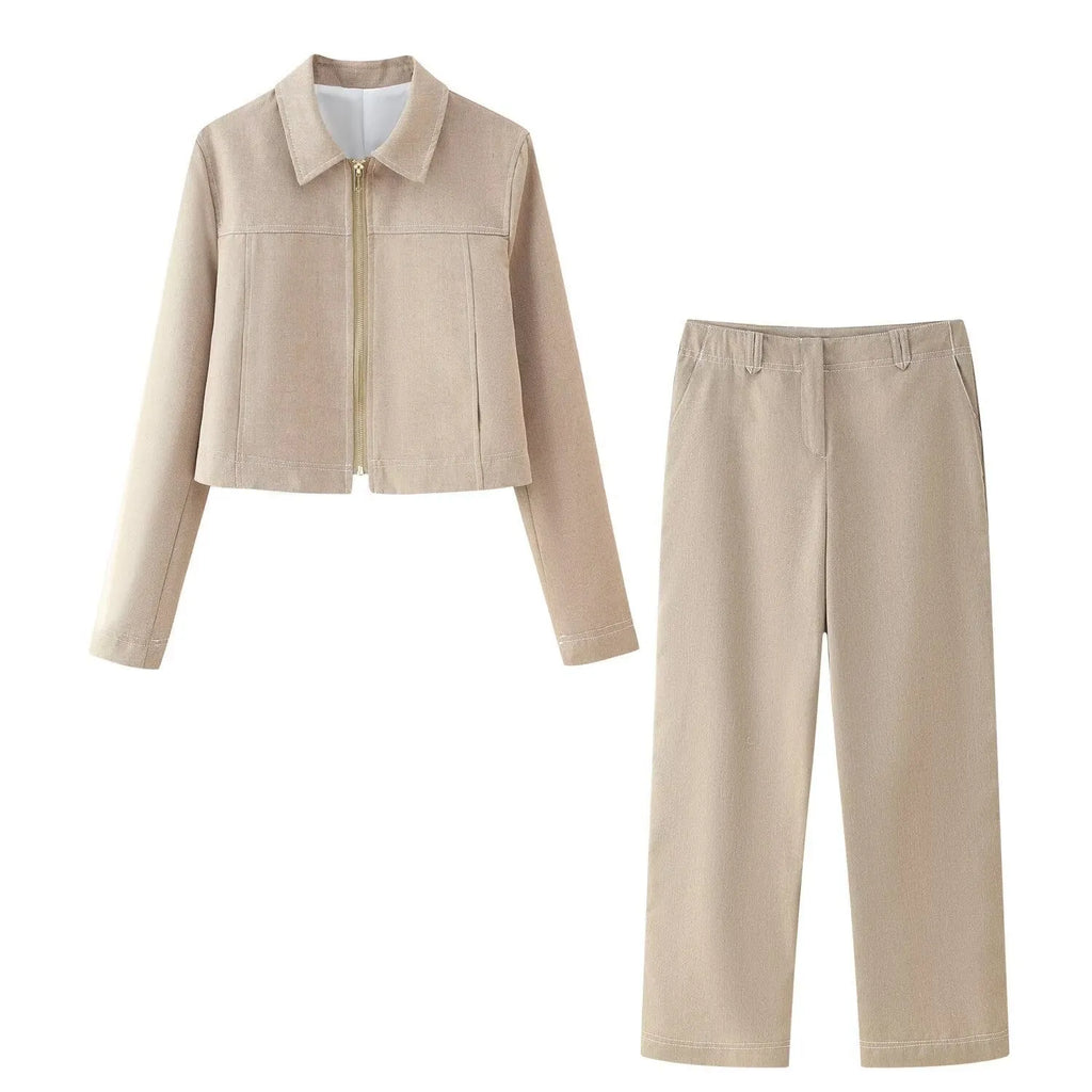 Women's black polyester suit set with 3D herringbone pattern and embroidery, showing jacket and trousers.