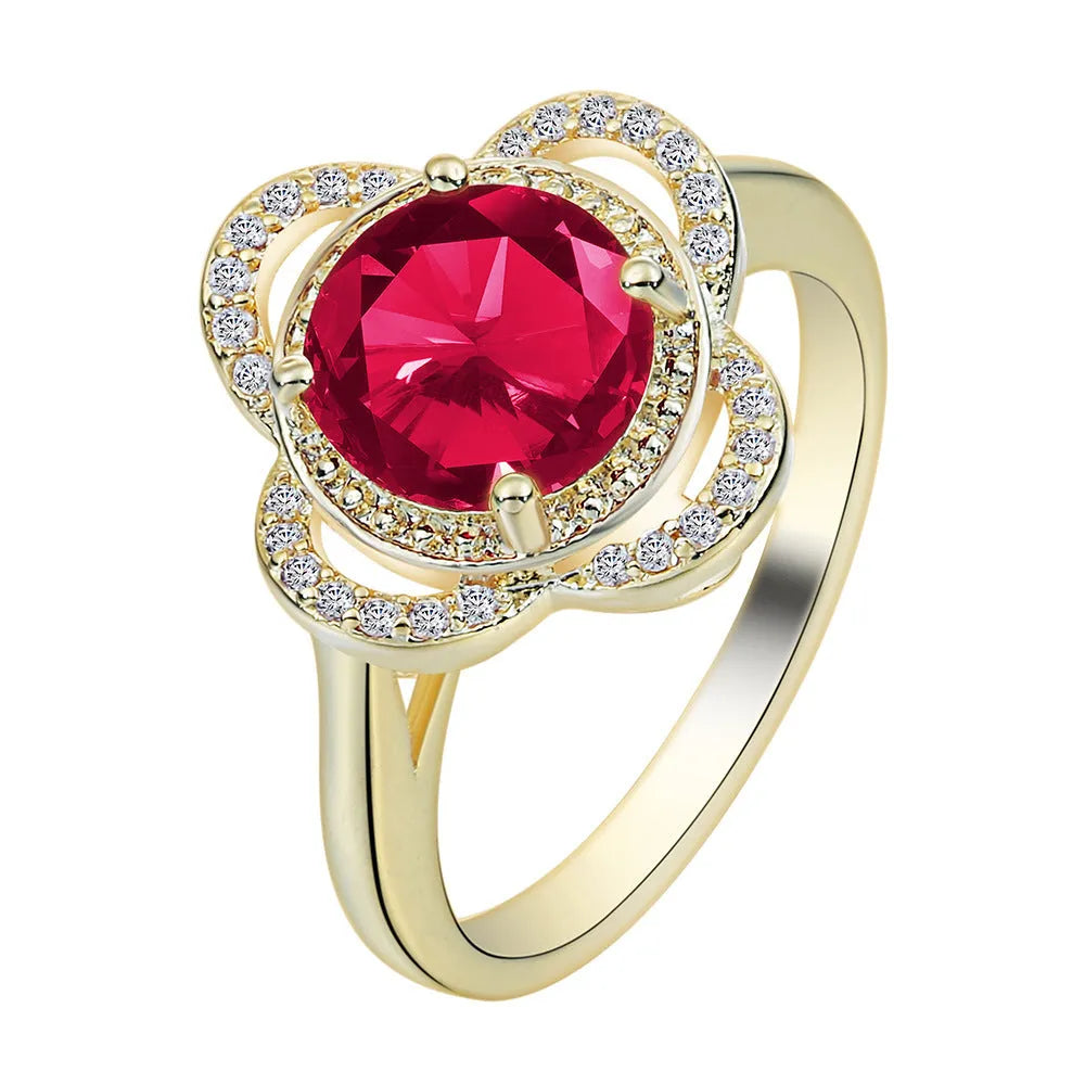 Copper fruit-shaped ring with inlaid zircon stones on a finger.
