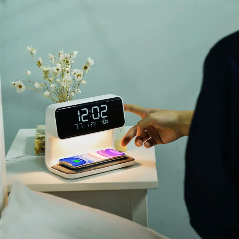 White 3-in-1 bedside lamp with wireless charging pad, LCD clock display, and touch controls.