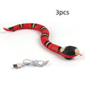 Smart sensing interactive electronic snake cat toy with textured plastic body on a floor