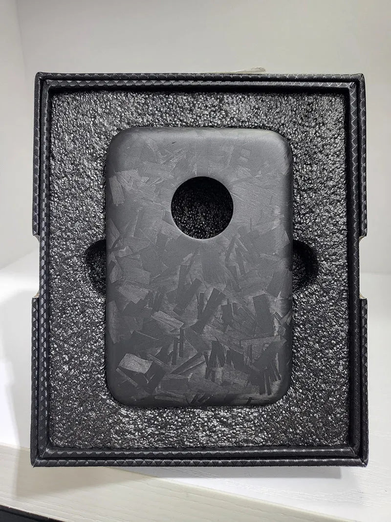 Black Kevlar hard shell case for Apple MagSafe power bank, shown in 3K round hole bright finish.