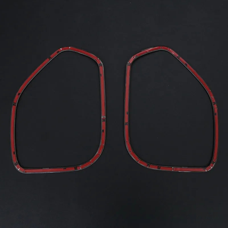 Two silver stainless steel door audio frame trim pieces for ROOX40 series vehicles