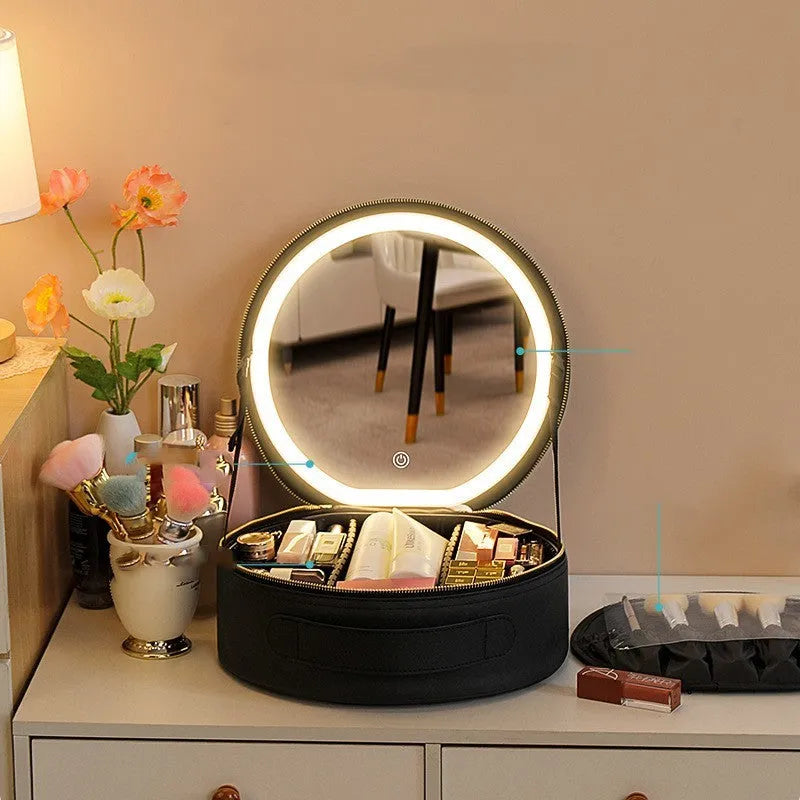Round black smart LED makeup bag with lighted mirror open, showing internal partitions.
