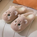 Cute cat plush slippers with non-slip EVA sole, thickened design, available in pink colour on a floor surface