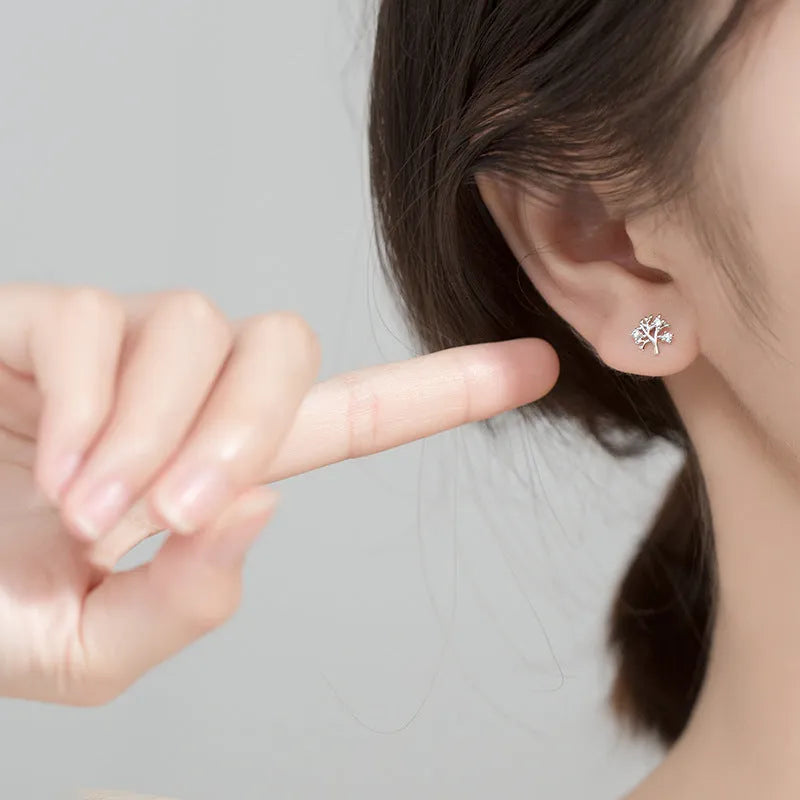 White gold coloured copper stud earrings with cute little tree design electroplated finish for women