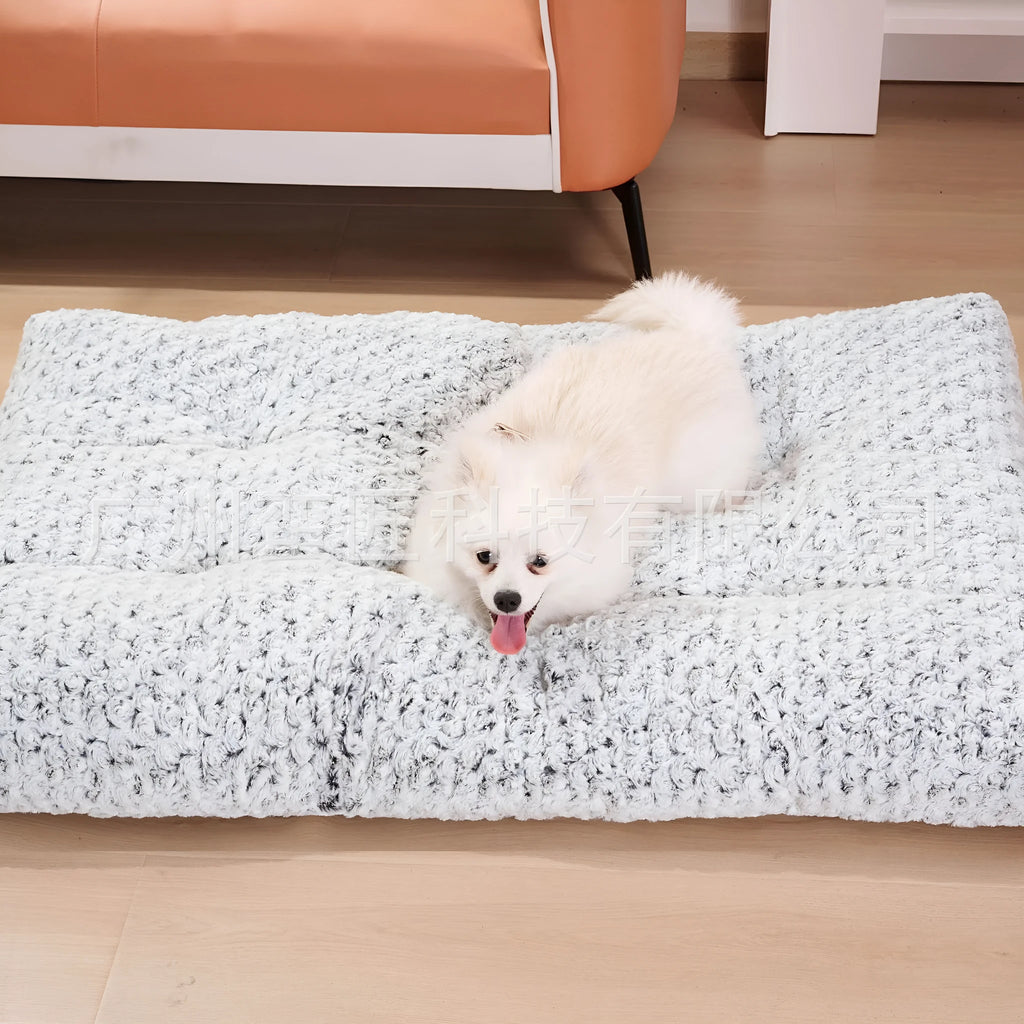 Light gray embossed velvet dog bed for small to large pets on a wooden floor