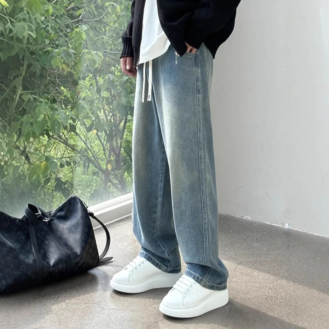 Men's straight-leg cotton jeans trousers in loose fit with drawstring waist