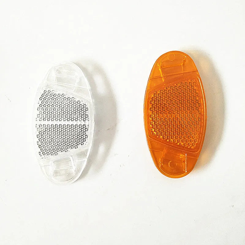 Set of 4 white and yellow plastic bicycle spoke reflectors showing 7.2cm x 3.5cm dimensions
