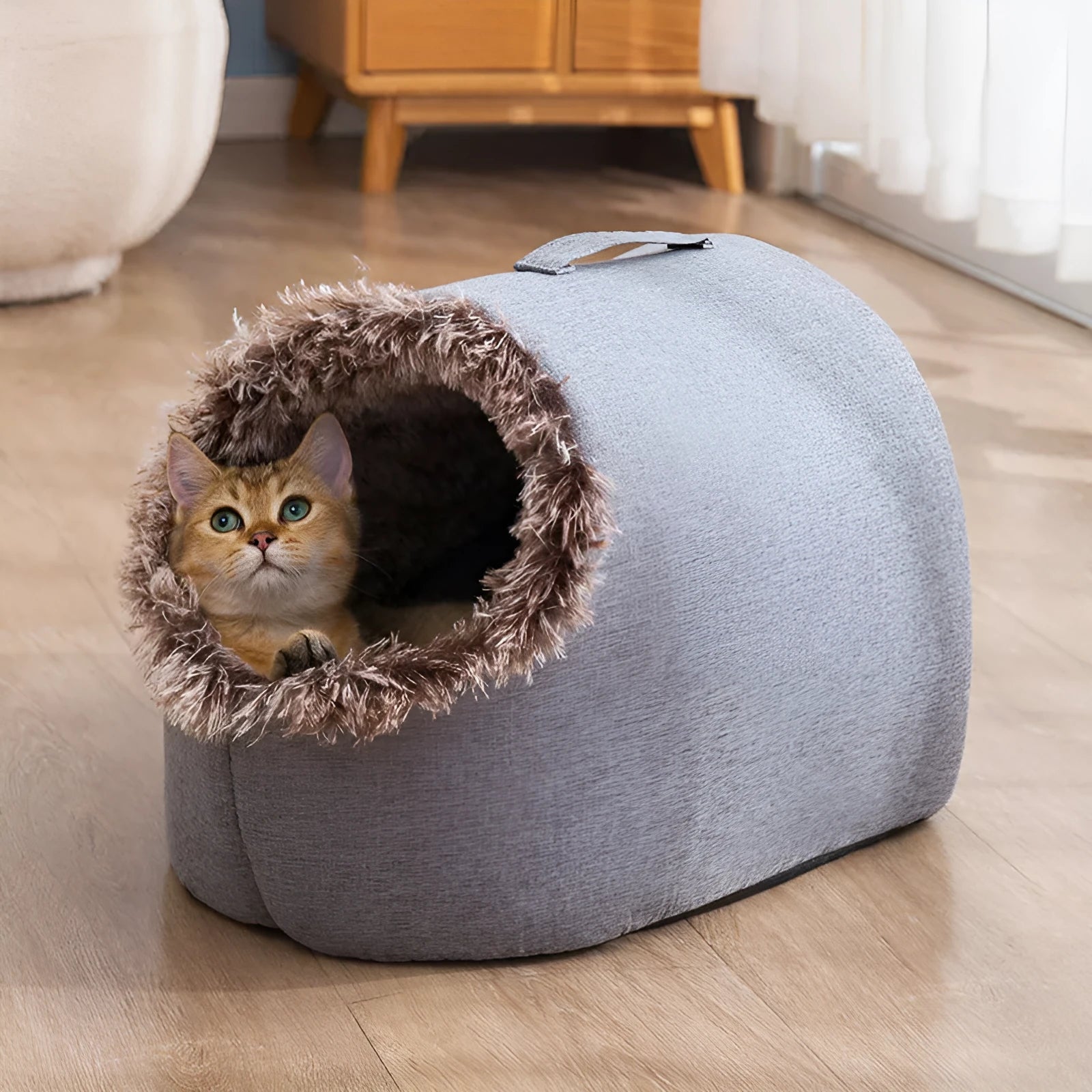 Grey fleece-lined closed cat sleeping bag bed showing enclosed nest design for winter warmth.